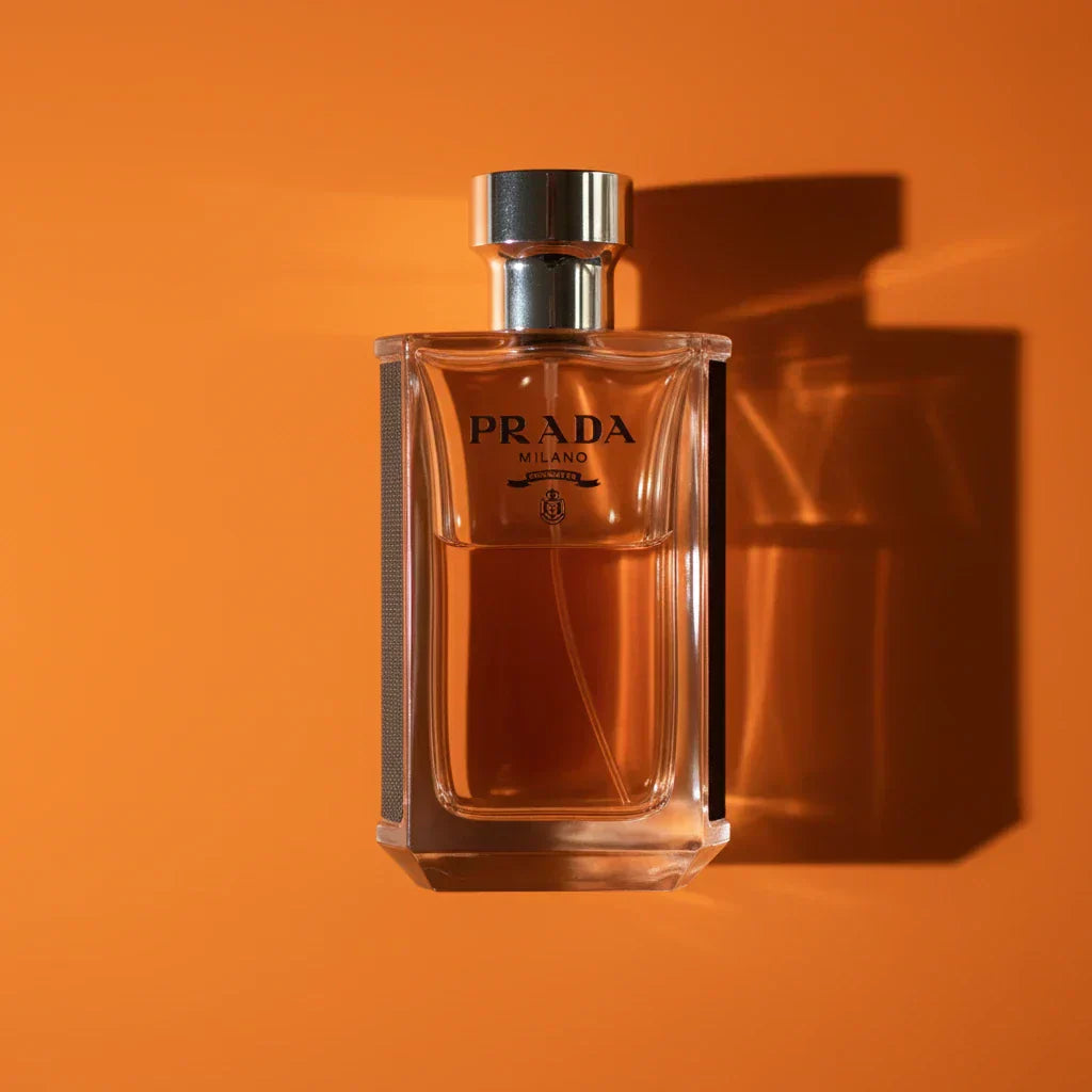Prada L’Homme perfume bottle on a reflective surface — fragrance review