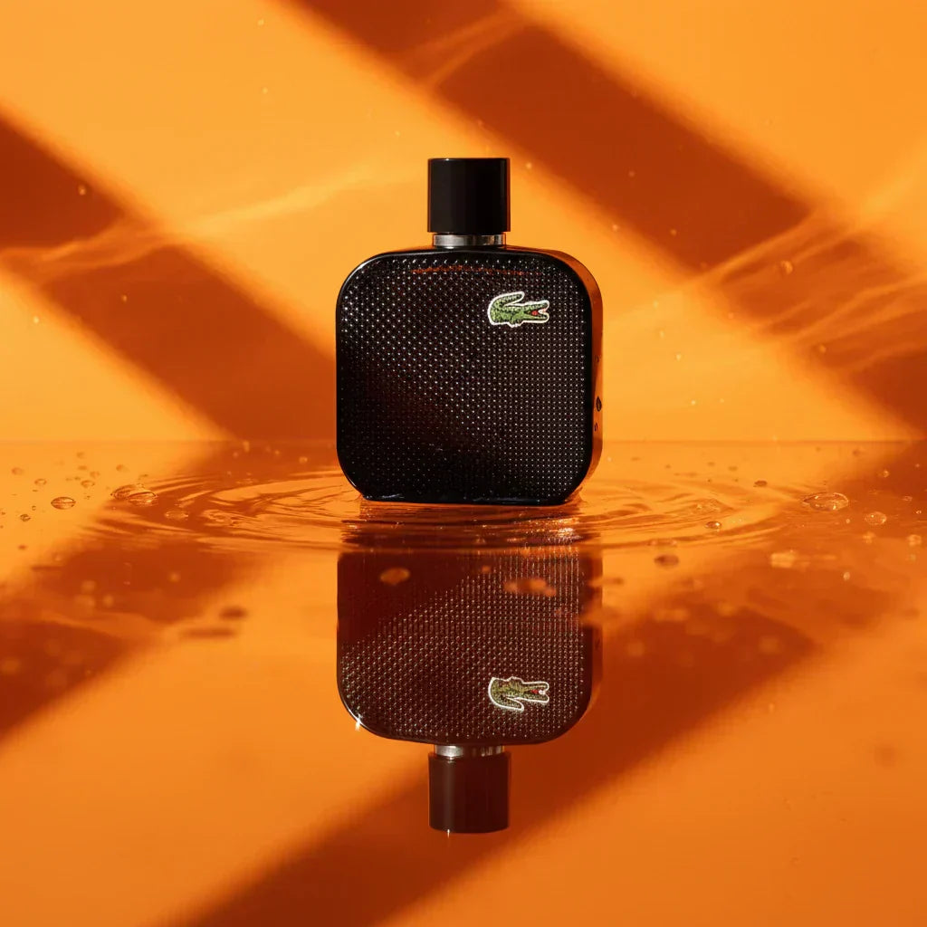 Lacoste L.12.12 Noir fragrance bottle reflected in a pool
