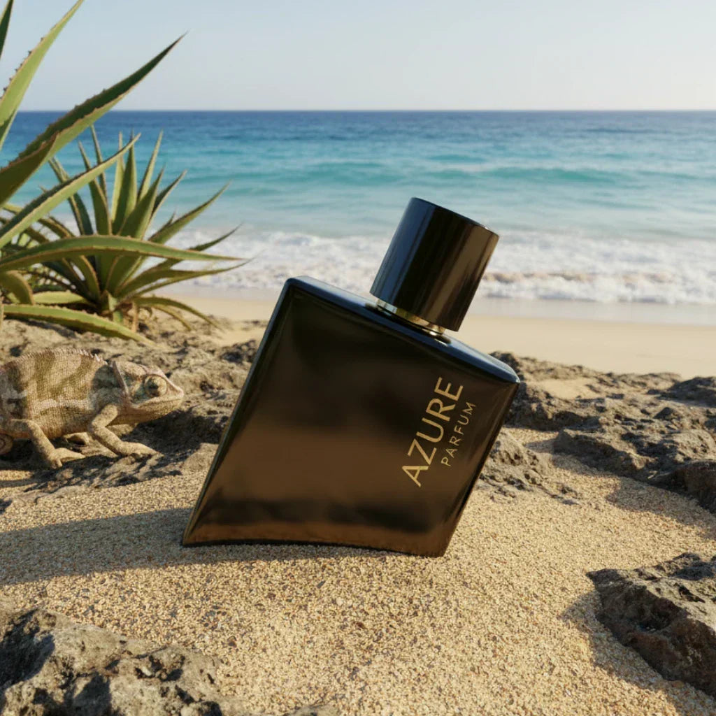Perfume bottle half-buried in beach sand illustrating fragrance and heat