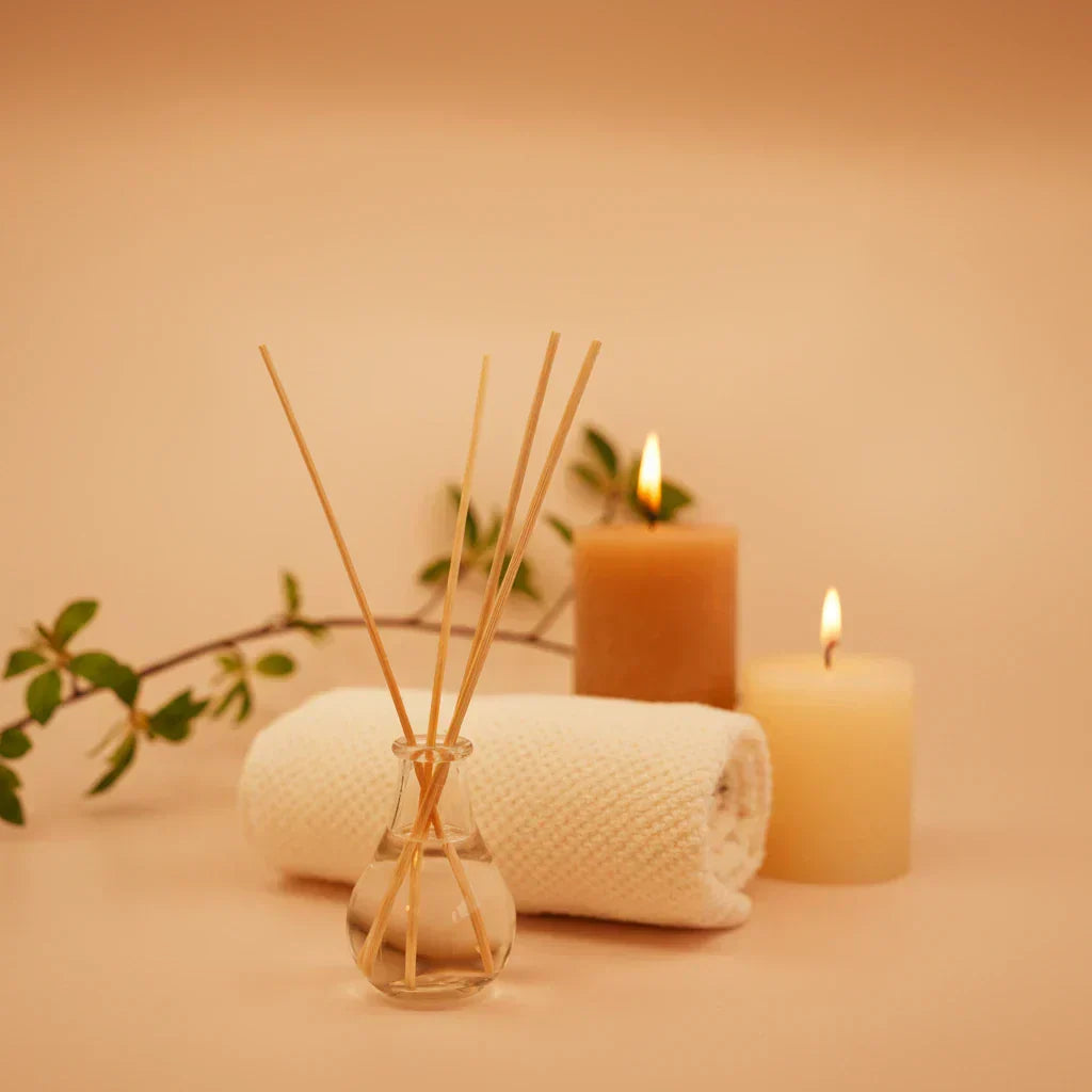 Warm orange spa flat lay with essential oils and massage carrier oils — aromatherapy massage guide