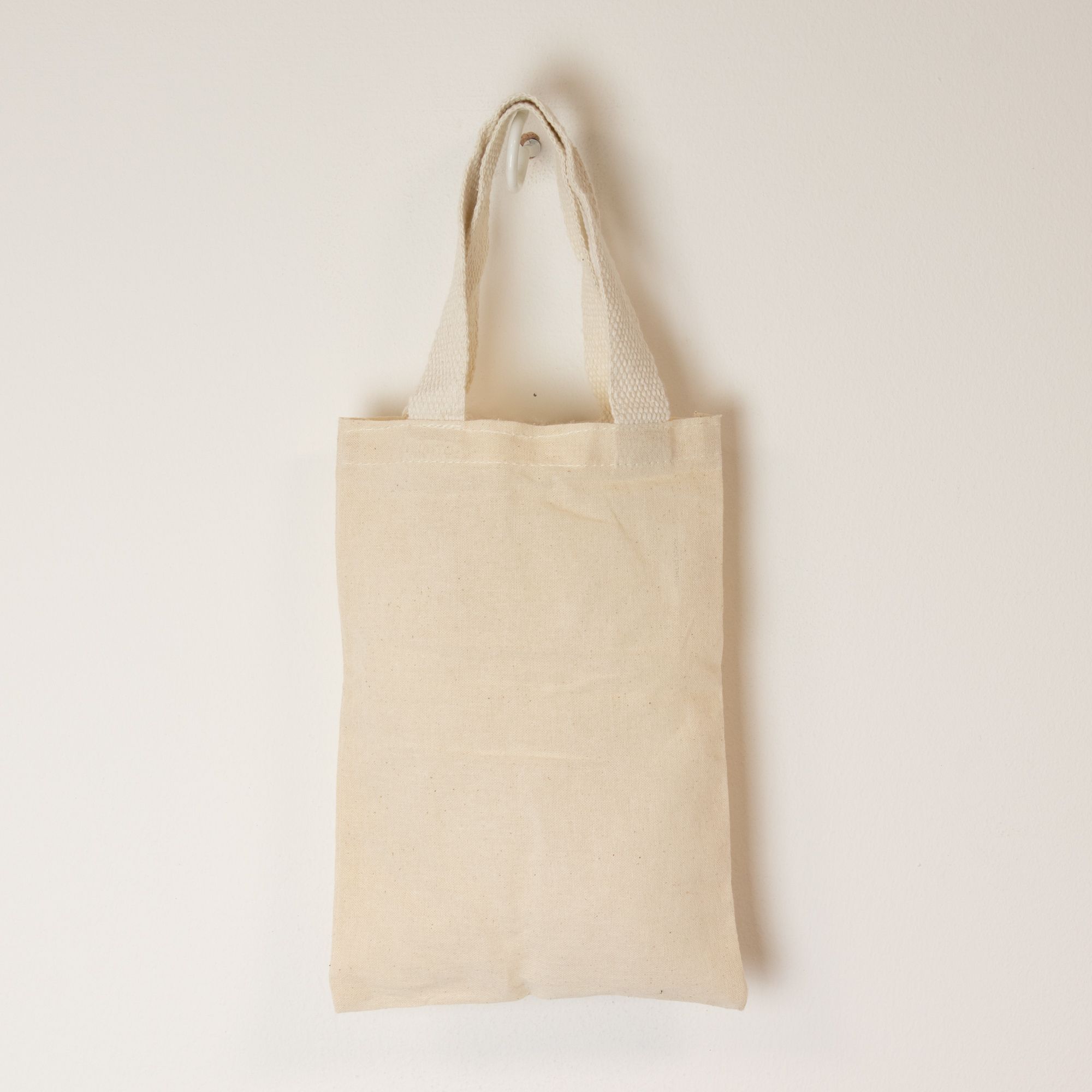 Beige tote bag on a light beige background