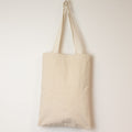 Beige tote bag on a white background