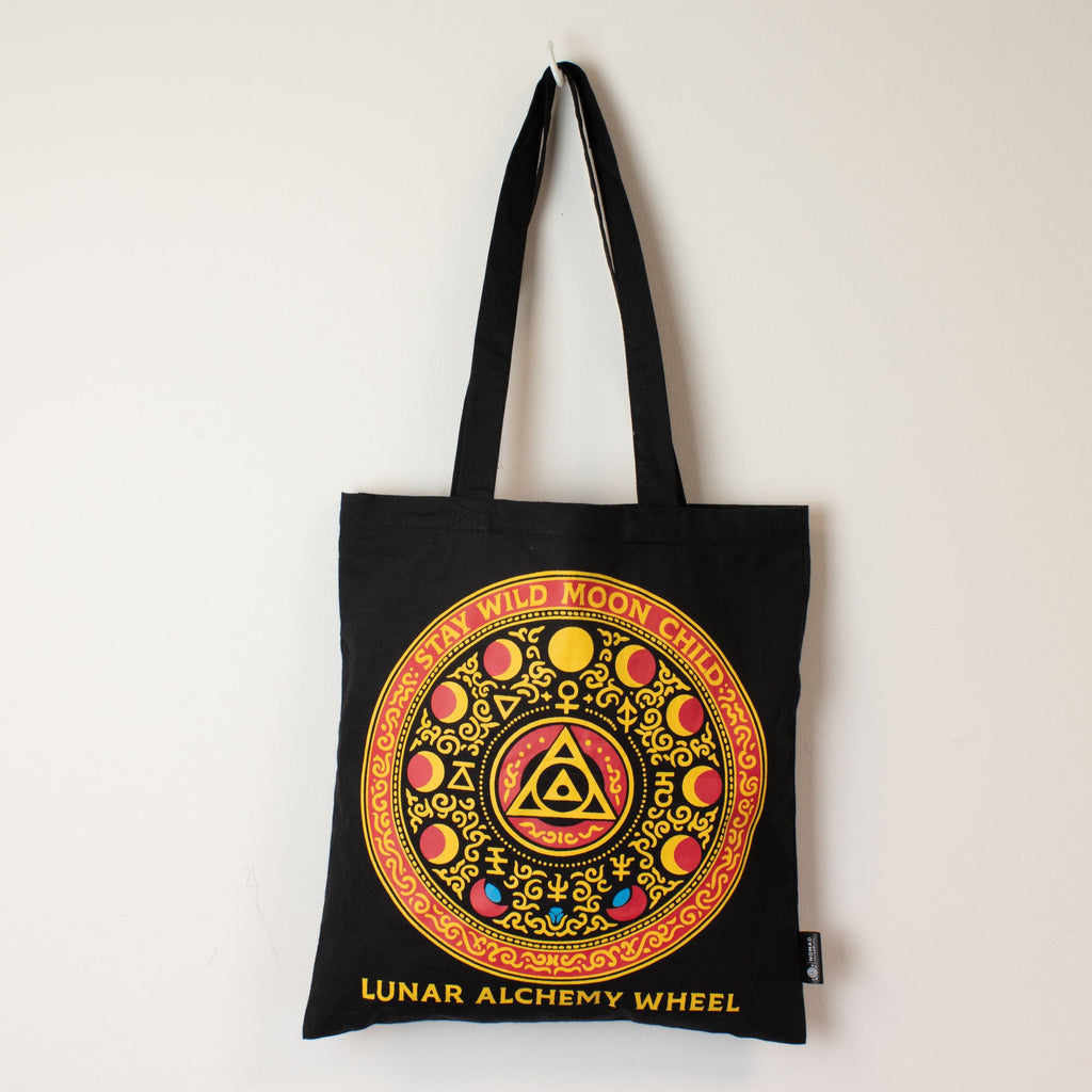 Black tote bag with colorful design and text on a white background