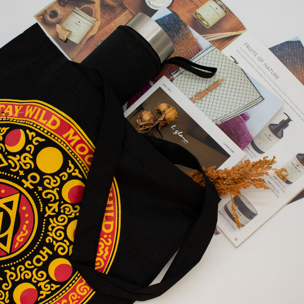 Black bag with colorful design on a magazine background