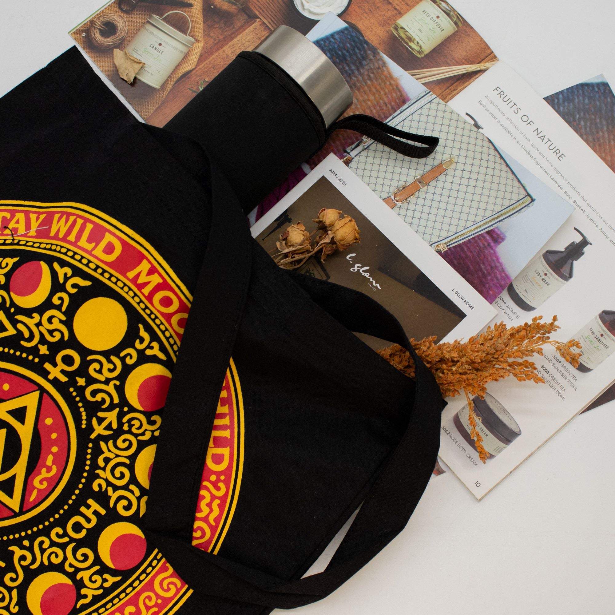 Black bag with colorful design on a magazine background