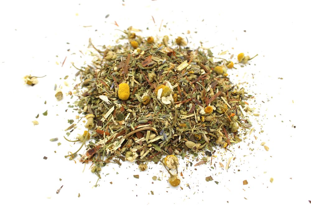 Heap of dried herbs on a white background
