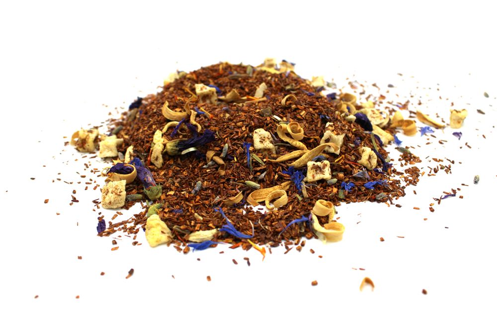 Heap of dried herbal tea leaves on a white background