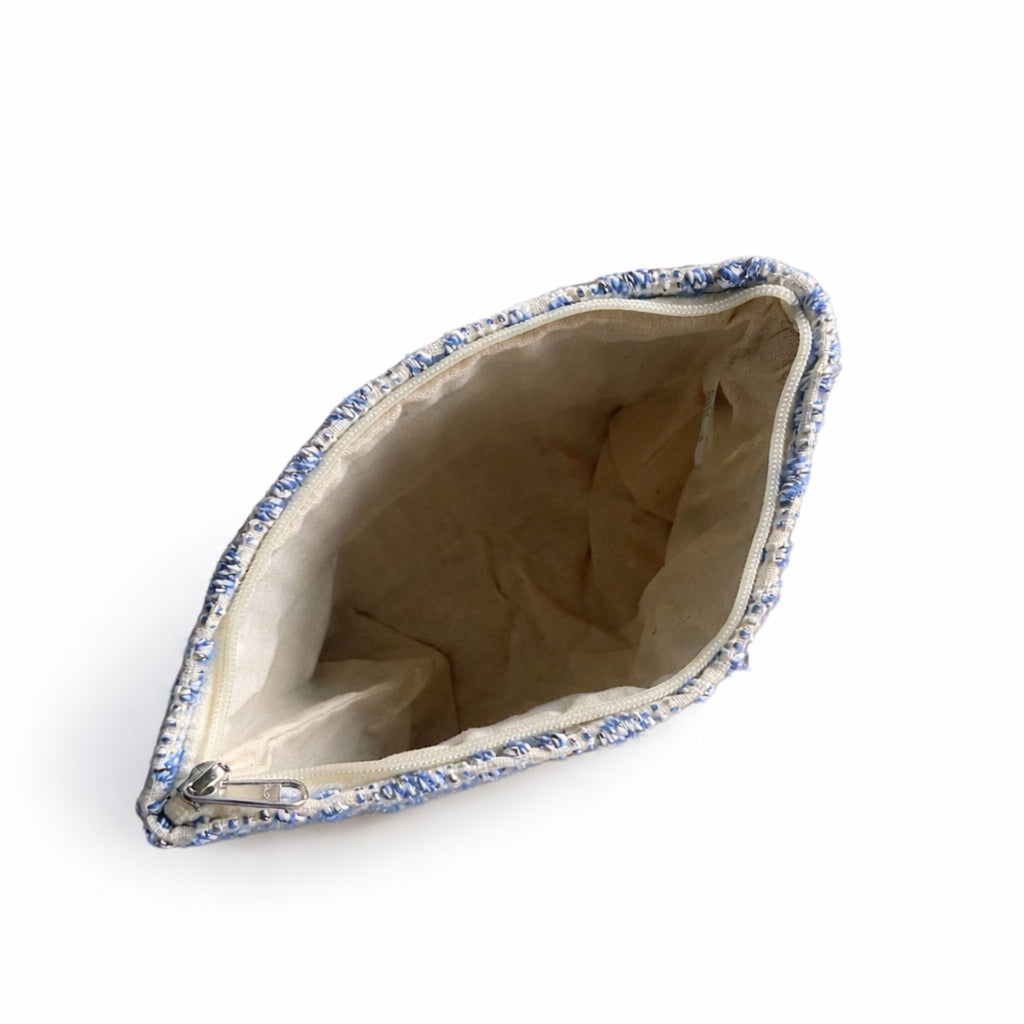 Small pouch with blue floral pattern on a white background