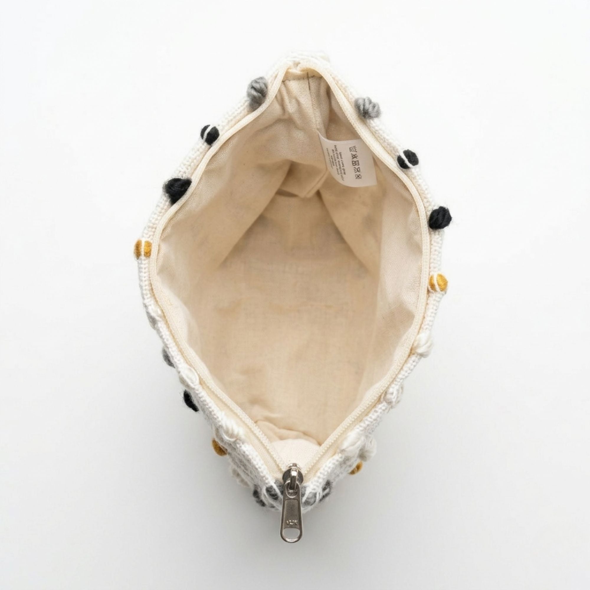 Small pouch with decorative elements on a white background