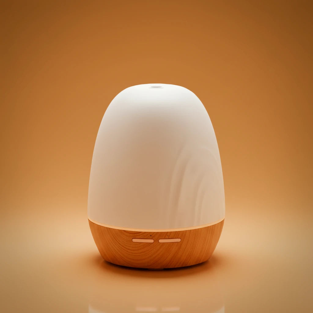 White and wooden diffuser on a warm orange background