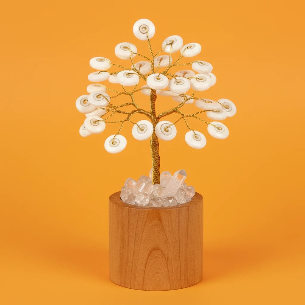 Decorative tree with white flowers and crystal base on an orange background